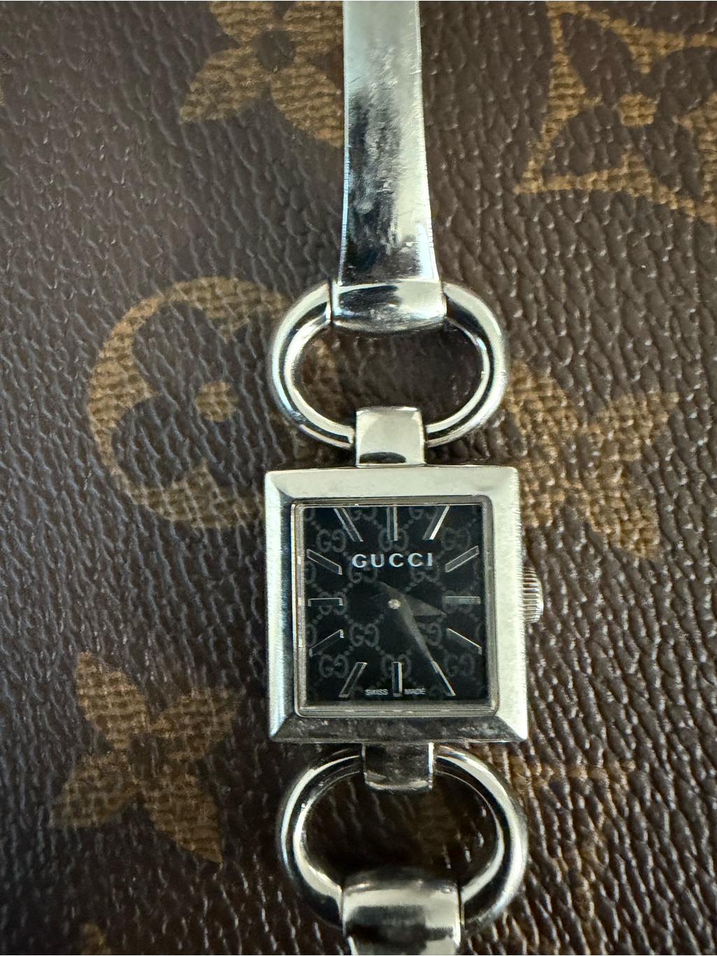 Gucci Silver Bracelet Watch With Black Logo Dial